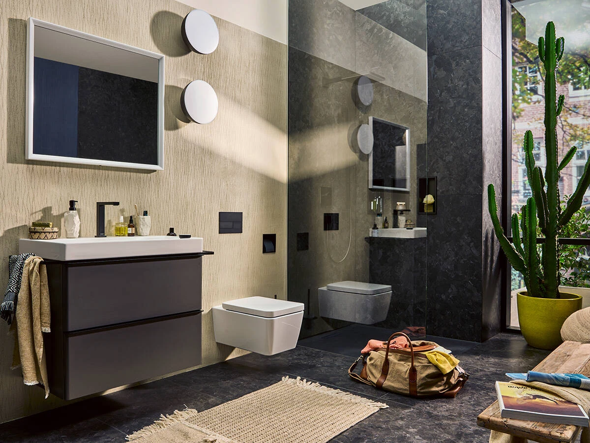 Baño con lavabo y ducha, dos puntos de consumo de agua caliente — reparacioncalderas.madrid