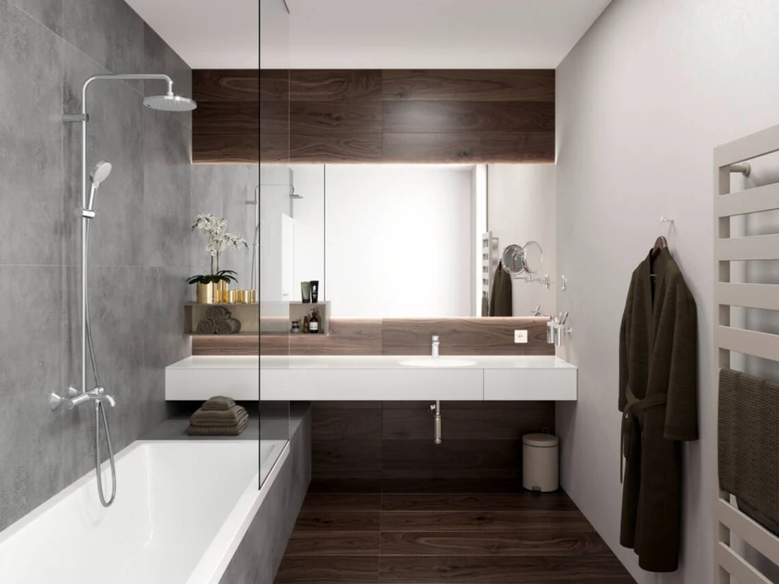 Baño con ducha, lavabo y radiador toallero, distintos usos del agua caliente — reparacioncalderas.madrid